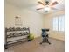 Home gym featuring weights, an exercise bench, and ample space for workouts at 43612 W Chambers Ct, Maricopa, AZ 85138