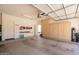 Spacious garage featuring ample storage cabinets and overhead lighting at 43612 W Chambers Ct, Maricopa, AZ 85138
