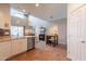 Open-concept kitchen with granite countertops, stainless steel appliances, and access to the outdoor living area at 43612 W Chambers Ct, Maricopa, AZ 85138