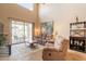 Inviting living room with patio access, comfortable seating, and natural light at 43612 W Chambers Ct, Maricopa, AZ 85138