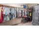 Well-organized walk-in closet with clothing racks and shelves for shoes and accessories at 43612 W Chambers Ct, Maricopa, AZ 85138