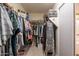 Spacious walk-in closet with ample storage and shelving for an organized wardrobe at 43612 W Chambers Ct, Maricopa, AZ 85138