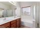 Bathroom boasts a double sink vanity, soaking tub, and a separate glass shower enclosure at 4617 W Alicia Dr, Laveen, AZ 85339