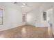 Bedroom area features neutral tile floor, a ceiling fan, and natural light at 4617 W Alicia Dr, Laveen, AZ 85339