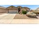 Inviting exterior view of a well-kept single-story house with desert landscaping at 4617 W Alicia Dr, Laveen, AZ 85339