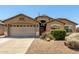 Charming single-story home featuring a well-maintained landscape and a two-car garage at 4617 W Alicia Dr, Laveen, AZ 85339