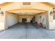 Garage with storage shelves, ladder, and water heater at 4617 W Alicia Dr, Laveen, AZ 85339