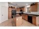 Efficient kitchen boasts tile floors, plenty of cabinet space, and modern appliances at 4617 W Alicia Dr, Laveen, AZ 85339
