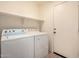 Laundry room featuring a washer, dryer, and shelving at 4617 W Alicia Dr, Laveen, AZ 85339
