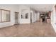 Bright living room overlooking the kitchen area, featuring tile floors and natural light at 4617 W Alicia Dr, Laveen, AZ 85339