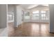 Bright living room boasts tile flooring, arched windows, and a pendant light fixture at 4617 W Alicia Dr, Laveen, AZ 85339
