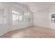 Spacious living area with tile flooring, ample natural light, and neutral color palette providing a versatile space at 4617 W Alicia Dr, Laveen, AZ 85339