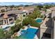 A tranquil aerial view of a stunning pool, spa, and lush backyard in a serene community setting at 4812 E Daley Ln, Phoenix, AZ 85054