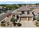 Beautifully landscaped home with a spacious three-car garage and manicured desert landscaping at 4812 E Daley Ln, Phoenix, AZ 85054