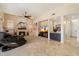 Spacious living room featuring a cozy fireplace, modern furnishings, and stylish decor elements at 4812 E Daley Ln, Phoenix, AZ 85054