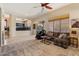 Inviting living room with a plush sofa, open layout, and seamless connection to the outdoor patio at 4812 E Daley Ln, Phoenix, AZ 85054