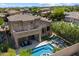 Inviting backyard oasis with a sparkling pool, covered patio, and comfortable seating area at 4812 E Daley Ln, Phoenix, AZ 85054