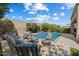 Stunning pool and spa surrounded by comfortable seating areas, lush landscaping, and mature trees at 4812 E Daley Ln, Phoenix, AZ 85054