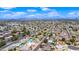 Excellent aerial view of the property's location in a neighborhood with mature trees, blue pools, and plenty of street parking at 5004 W Kaler Dr, Glendale, AZ 85301