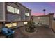 Private backyard featuring brick pavers, potted plants, seating area and lots of natural light at 5004 W Kaler Dr, Glendale, AZ 85301
