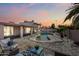 A beautiful outdoor space featuring a uniquely shaped swimming pool and beautiful landscaping at 5004 W Kaler Dr, Glendale, AZ 85301