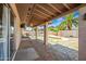 A covered patio area featuring tile flooring, and a unique shaped swimming pool at 5004 W Kaler Dr, Glendale, AZ 85301
