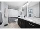 Stylish bathroom featuring a sleek vanity with a white countertop and modern fixtures, plus shower-tub combo at 5004 W Kaler Dr, Glendale, AZ 85301