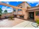 Charming home featuring a brick-paved front yard, covered patio, and unique architectural details at 5004 W Kaler Dr, Glendale, AZ 85301