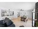 Open concept living area with dining space, kitchen bar, and stylish furnishings and decor at 5004 W Kaler Dr, Glendale, AZ 85301