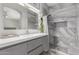 Stylish bathroom featuring gray marble tile shower with glass door and gray vanity at 5015 E Cheyenne Dr # 31, Phoenix, AZ 85044