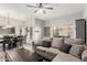 Open-concept living room with dining area, a comfortable sofa and neutral tones creating an inviting atmosphere at 5015 E Cheyenne Dr # 31, Phoenix, AZ 85044