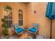 Inviting patio with seating area featuring colorful cushions and a vibrant rug at 5015 E Cheyenne Dr # 31, Phoenix, AZ 85044