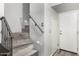 Staircase featuring modern wooden steps with metal railing, providing access to different levels of the home at 5015 E Cheyenne Dr # 31, Phoenix, AZ 85044