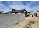 View of the backyard showcasing the perimeter wall and construction on an additional dwelling unit at 520 W Mcneil St, Phoenix, AZ 85041