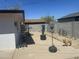 Backyard featuring a concrete area, weight equipment, and a friendly dog on a sunny day at 520 W Mcneil St, Phoenix, AZ 85041