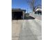 Wide concrete driveway leading to a garage, showcasing ample parking and backyard access at 520 W Mcneil St, Phoenix, AZ 85041