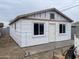 Exterior view of home showcasing window and door features, insulation, and construction progress at 520 W Mcneil St, Phoenix, AZ 85041