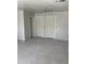 Freshly painted living room featuring tile floors and new doors at 520 W Mcneil St, Phoenix, AZ 85041