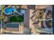 Aerial view showcasing the roof, pool, landscaping, solar panels, and layout of the property at 5511 N 128Th Dr, Litchfield Park, AZ 85340