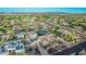 Aerial view of a home with a well-manicured lot and a pool in a verdant community at 5511 N 128Th Dr, Litchfield Park, AZ 85340