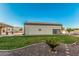Large backyard with lawn and shed with solar panels on the roof at 5511 N 128Th Dr, Litchfield Park, AZ 85340