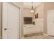 The bathroom features a tub and large window for natural light and a white subway tile surround at 5511 N 128Th Dr, Litchfield Park, AZ 85340