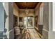 Covered entryway with tiled flooring, decorative chandelier, and seating area perfect for welcoming guests at 5511 N 128Th Dr, Litchfield Park, AZ 85340