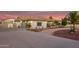 Inviting single story home with a desert landscaped front yard and attached RV garage at 5511 N 128Th Dr, Litchfield Park, AZ 85340