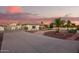 Beautiful home with a long driveway, lush desert landscaping, and an attached garage at 5511 N 128Th Dr, Litchfield Park, AZ 85340