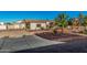 Inviting single story home with a desert landscaped front yard and attached RV garage at 5511 N 128Th Dr, Litchfield Park, AZ 85340