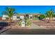 Beautiful single-story home with desert landscaping and an inviting walkway at 5511 N 128Th Dr, Litchfield Park, AZ 85340