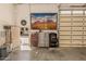 Well-lit garage with work bench, tool storage, and wall art at 5511 N 128Th Dr, Litchfield Park, AZ 85340