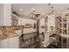 Spacious kitchen with white cabinets, granite countertops, and stainless steel appliances at 5511 N 128Th Dr, Litchfield Park, AZ 85340