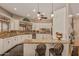 Beautiful kitchen with a breakfast bar, granite countertops, and plenty of cabinet space at 5511 N 128Th Dr, Litchfield Park, AZ 85340